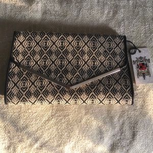 Clutch purse with attachable metallic strap